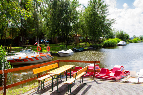 Boats and pedal boats by the pier, Baltic Sea, Poland