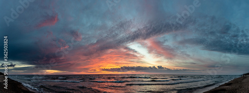 scenic view of bright summer sunset over the sea