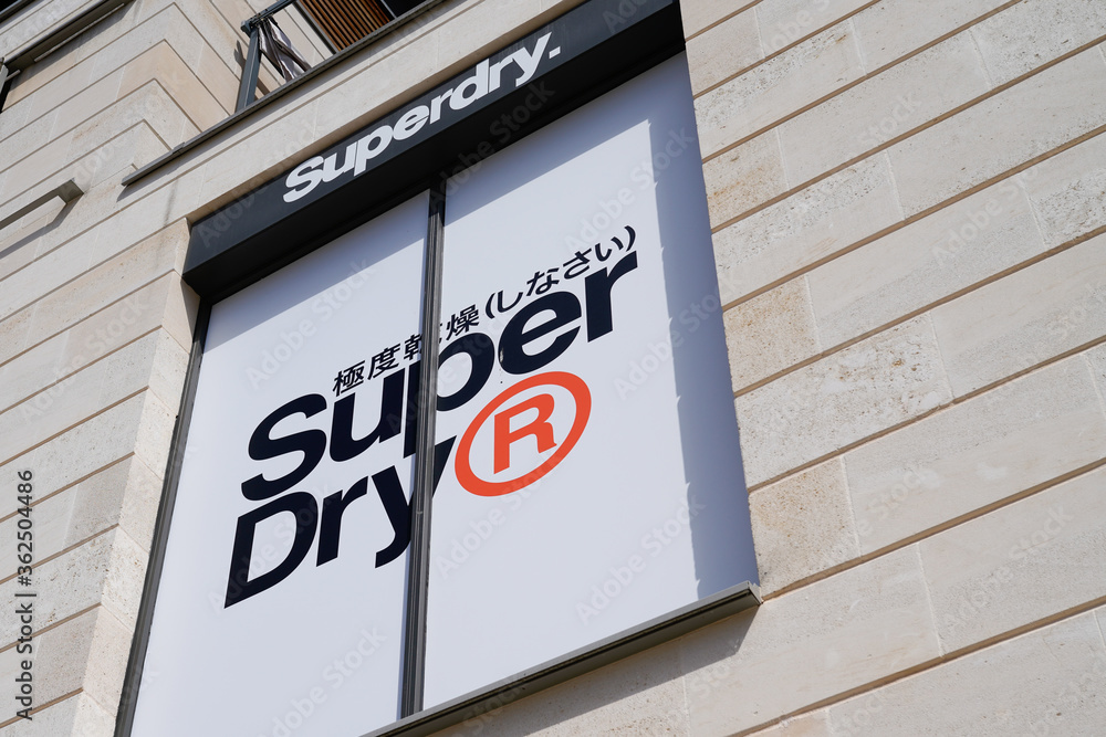 Superdry logo sign on wall store of British clothing company store Stock  Photo | Adobe Stock