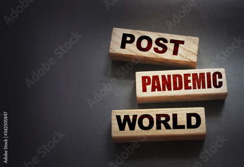 Wooden blocks with words Post-pandemic world. New normal social concept photo