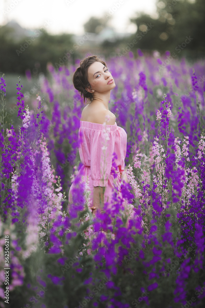 Very beautiful young woman with flowers. Close up portrait of attractive female Very beautiful young woman with flowers. Close up portrait of attractive female