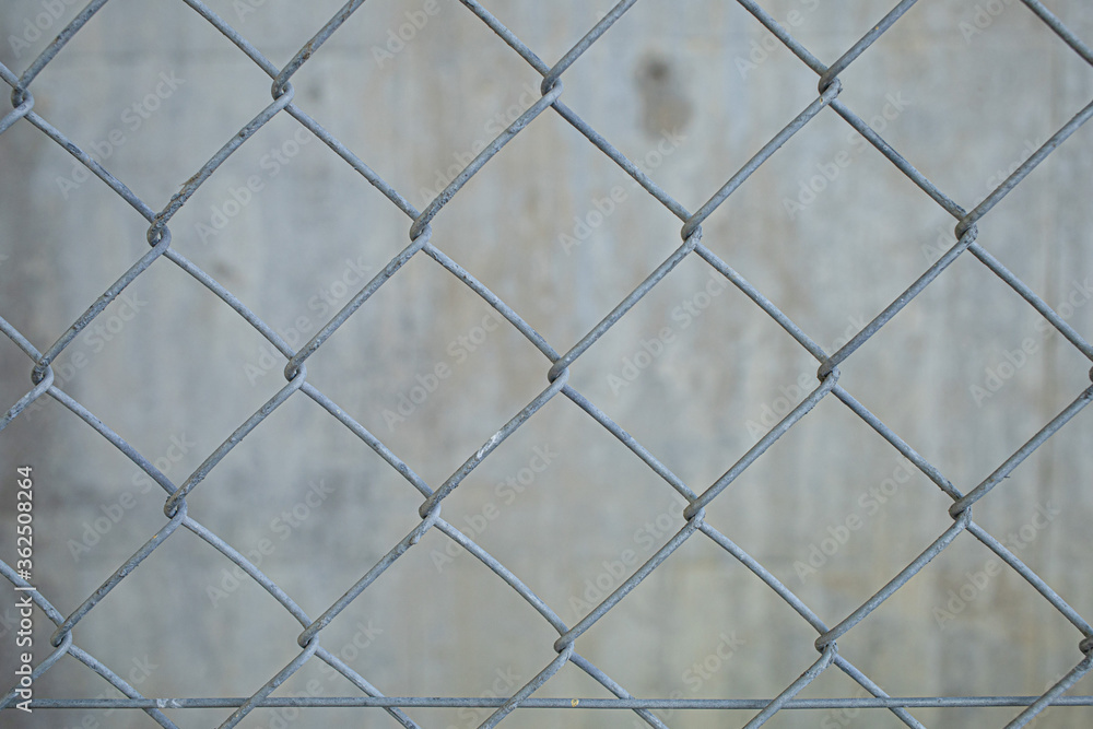 Fototapeta premium An old wire mesh with a diamond pattern.