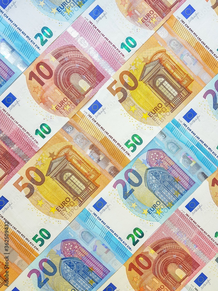 Paper money of the euro on a white background neatly laid out, straight, smooth. Denomination twenty, ten, fifty, five euros. Savings. Saving. Credit. Spare pillow for a rainy day. Paper money of the euro on a white background neatly laid out, straight, smooth. Denomination twenty, ten, fifty, five euros. Savings. Saving. Credit. Spare pillow for a rainy day.