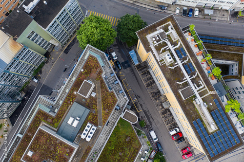Photography Aerial view of modern office building with roof terrace in the city