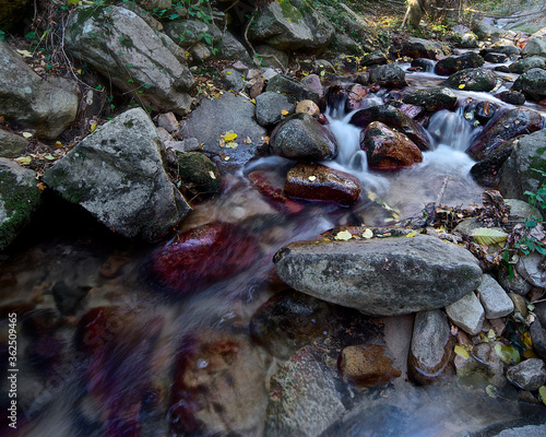River water flowing through stones