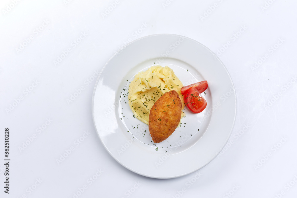 cutlet with mashed potato and tomato