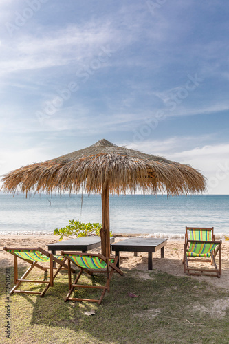 Fototapeta Naklejka Na Ścianę i Meble -  Beach Umbrella and Sunbed, Koh Mak Beach, Koh Mak island, Thailand.