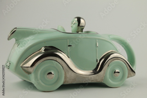 Vintage Staffordshire pottery novelty car teapot isolated on a white background. Upholland, Lancashire, UK, 04/07/2020:  - editorial  photo