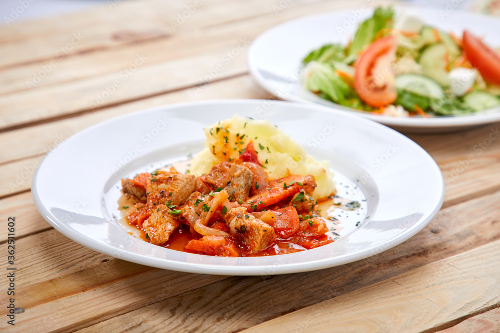 chicken with mashed potatoes and salad on the wooden background chicken with mashed potatoes and salad on the wooden background
