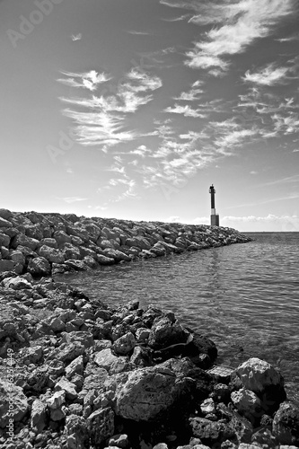 lighthouse on the shore pier