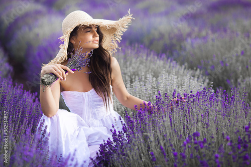 Close up portrait of beautiful young woman in lavender field.