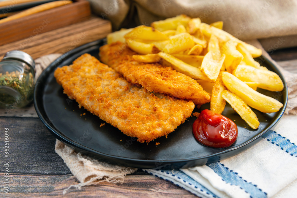 British Traditional fish and chips and tartar sauce British Traditional fish and chips and tartar sauce