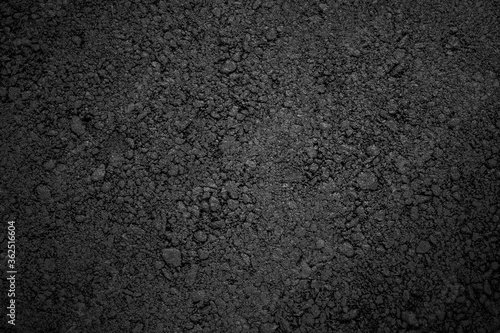 Asphalt texture, black fading background with vignetting.
