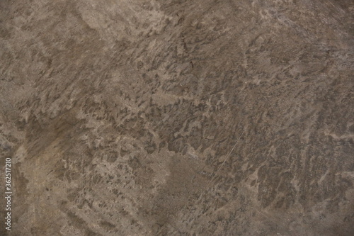 fondo abstracto con manchas grises sobre suelo de cemento © miquel