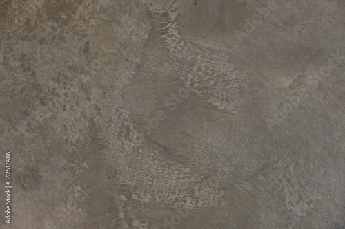 fondo abstracto con manchas grises sobre suelo de cemento