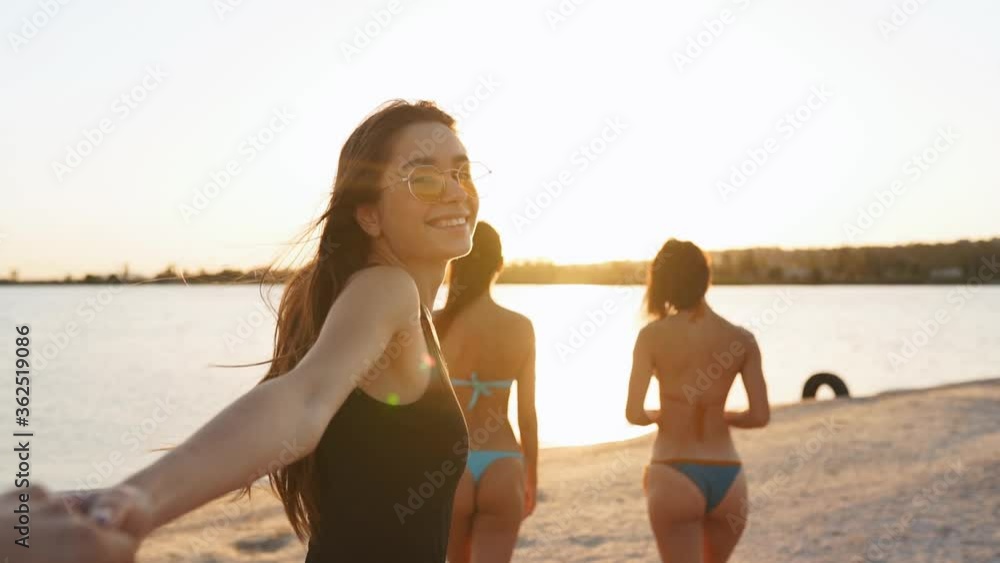 vid-o-stock-follow-me-pov-of-pretty-woman-in-swimsuit-leads-boyfriend