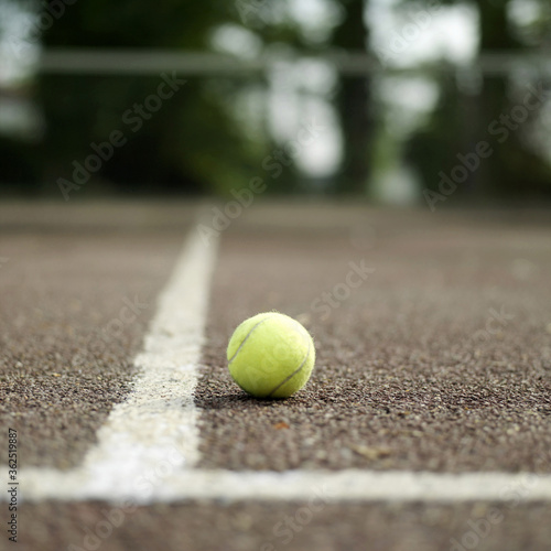 Tennis ball in tennis court © ImageHit