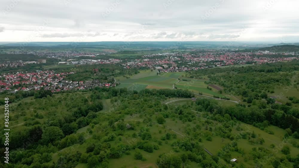 Aerial view of the extensive rural plains in southern Germany with lots of lush green forests and fields and smaller villages. 60FPS UHD Aerial view of the extensive rural plains in southern Germany with lots of lush green forests and fields and smaller villages. 60FPS UHD