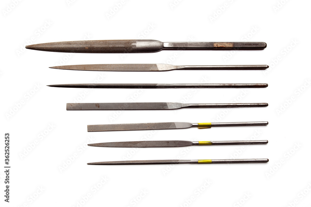 Different goldsmiths tools on the jewelry workplace. Craft jewelry making with professional tools. Set of tools over white background. Different goldsmiths tools on the jewelry workplace. Craft jewelry making with professional tools. Set of tools over white background.