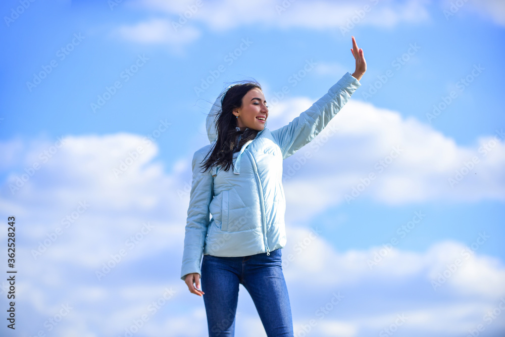 Ambitious and beautiful. Freedom and expectation. Beauty and fashion, look. concept of loneliness. girl blue sky background. woman in model pose outdoors. feel free. woman enjoying weather outdoors Ambitious and beautiful. Freedom and expectation. Beauty and fashion, look. concept of loneliness. girl blue sky background. woman in model pose outdoors. feel free. woman enjoying weather outdoors