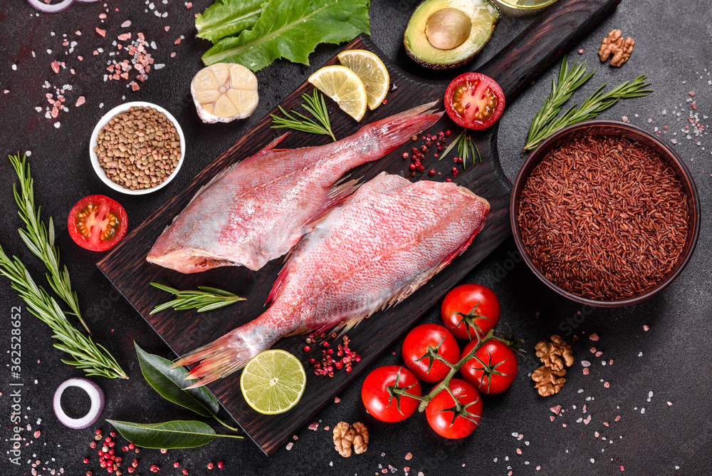 Raw fillet of red sea perch prepared for baking with spices and herbs Raw fillet of red sea perch prepared for baking with spices and herbs