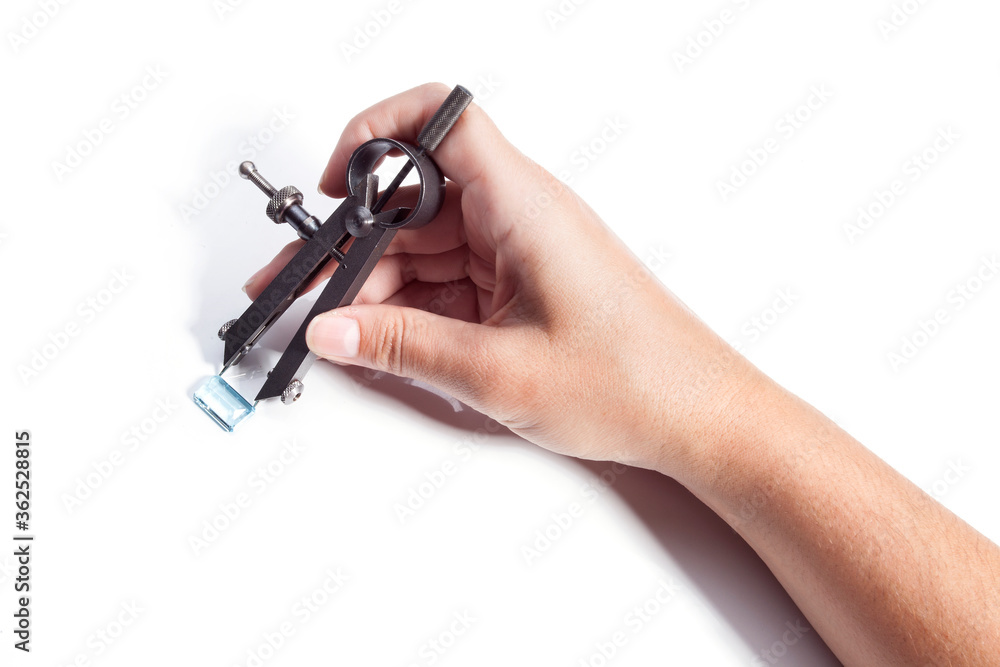 Different goldsmiths tools on the jewelry workplace. Desktop for craft jewelry making with professional tools. White background. Different goldsmiths tools on the jewelry workplace. Desktop for craft jewelry making with professional tools. White background.
