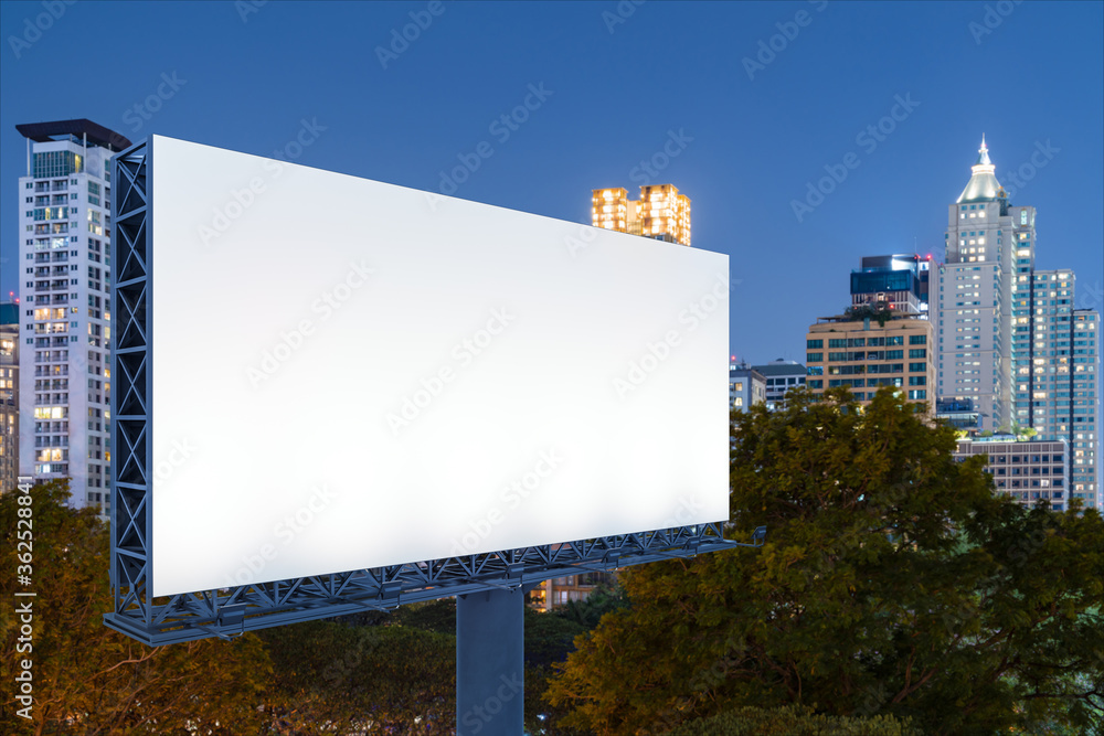 Fototapeta premium Blank white road billboard with Bangkok cityscape background at night time. Street advertising poster, mock up, 3D rendering. Side view. The concept of marketing communication to sell idea.