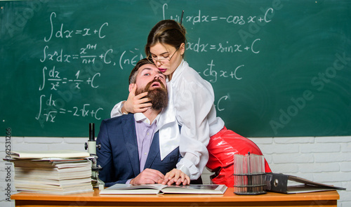 Teaching with passion. Resist temptation. Sexual temptation at workplace. Victim of circumstances. Teacher student flirting. Sexual provocation. Provoke sexual desire. Desirable girl cuddle man