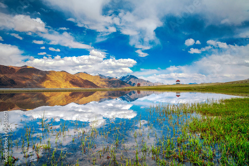 Landscape with reflections of the mountains on the lake named Pagong Tso, situated on the border with India and China.