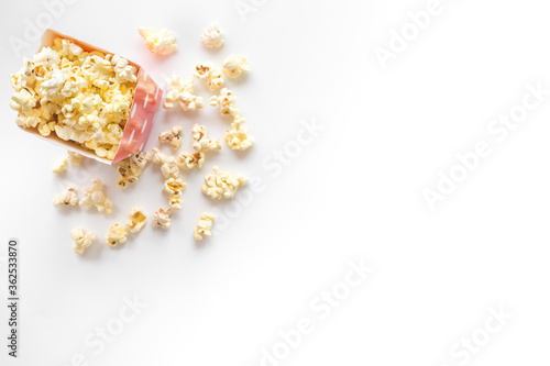 Top view of popcorn in cup on white background copy space