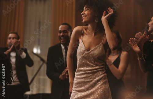 Beautiful african woman dancing at gala event