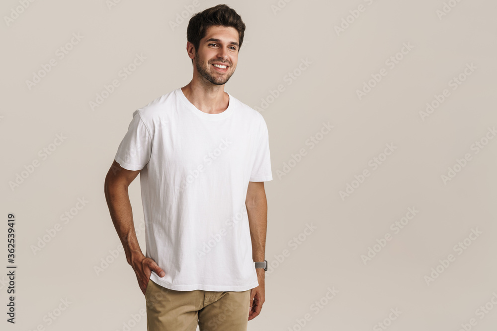 Portrait of cheerful handsome man smiling and looking aside Portrait of cheerful handsome man smiling and looking aside