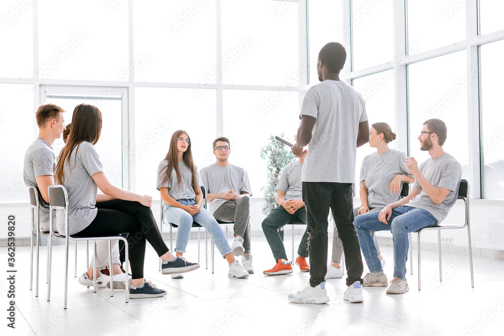 group of young people applauding at a business training