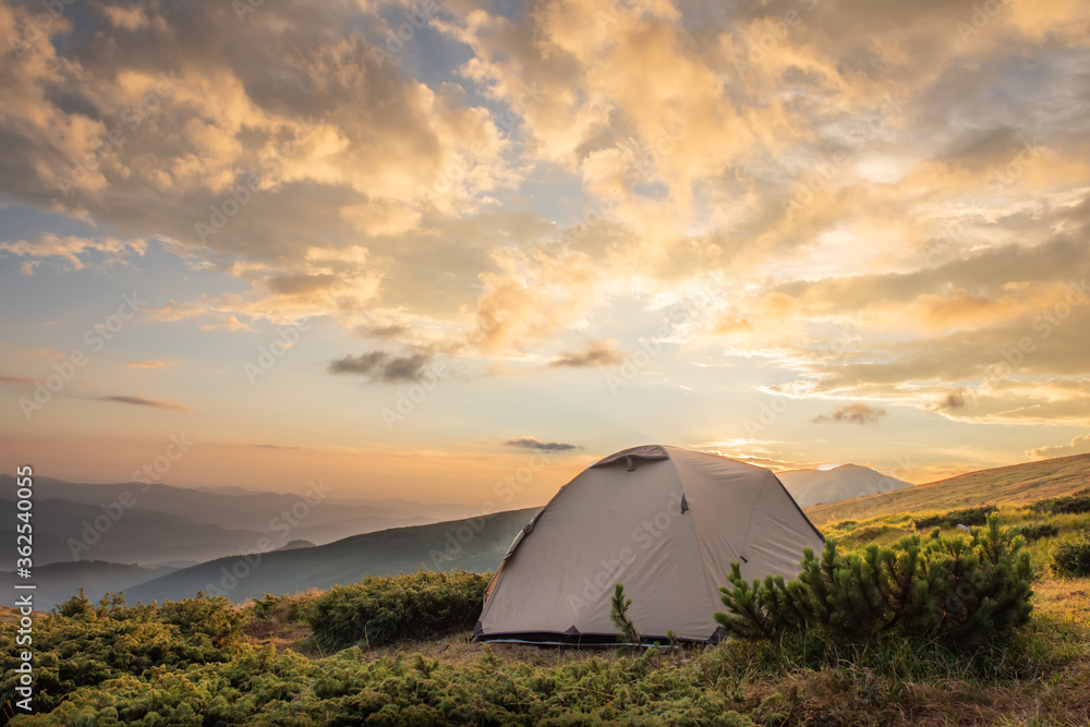 Camping tent in morning sun ray. Active lifestyle. Tatra mountains Zakopane, Poland