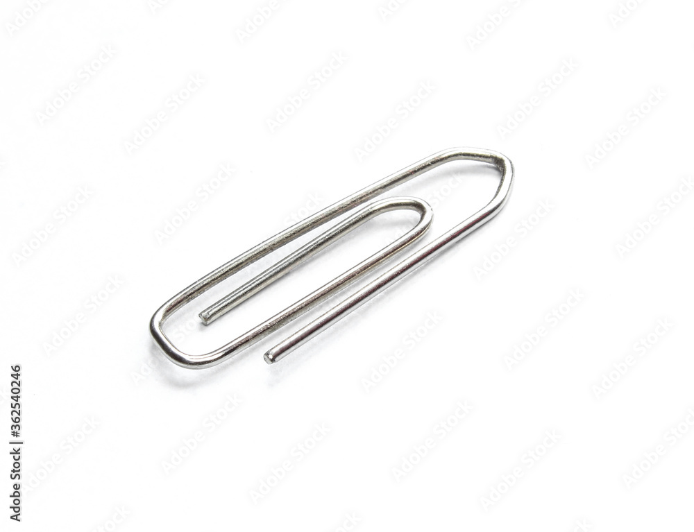 Silver metallic paperclip isolated on white background. Silver metallic paperclip isolated on white background.