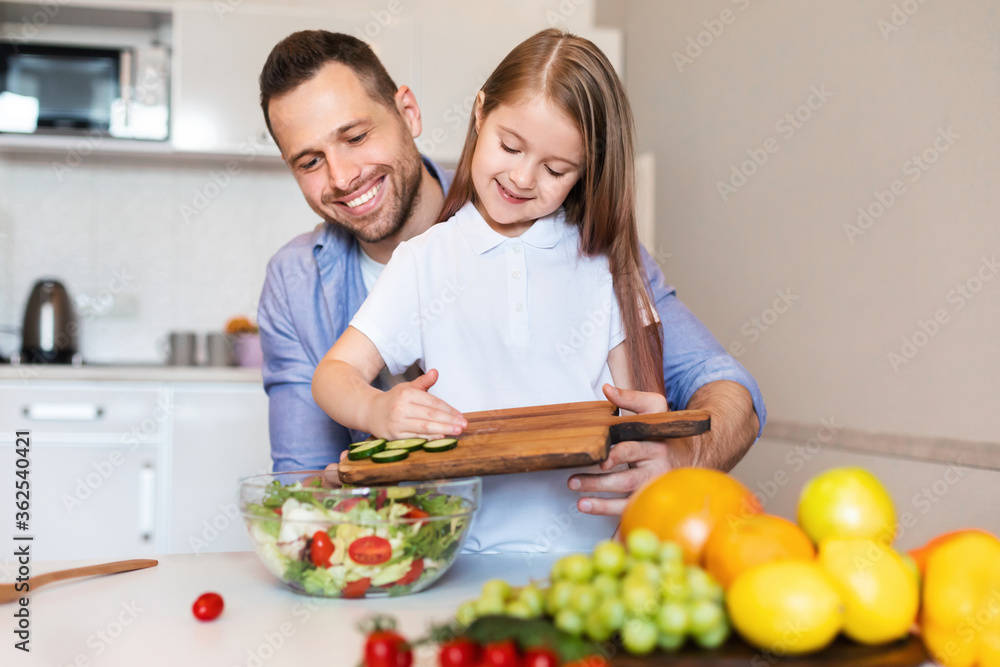 Kid Girl Cooking With Daddy Making Vegetable Salad In Kitchen Kid Girl Cooking With Daddy Making Vegetable Salad In Kitchen