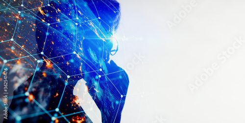 Double exposure of Asian woman using smart phone with The World of Futuristic internet communication concept.Elements of this image furnished by NASA.