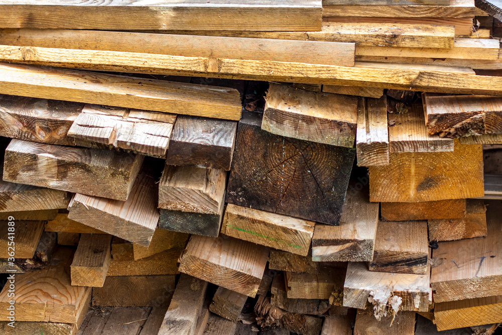 A stack of old and damp boards. Boards for construction work are in a compact form. Carpenter, plank. A stack of old and damp boards. Boards for construction work are in a compact form. Carpenter, plank.