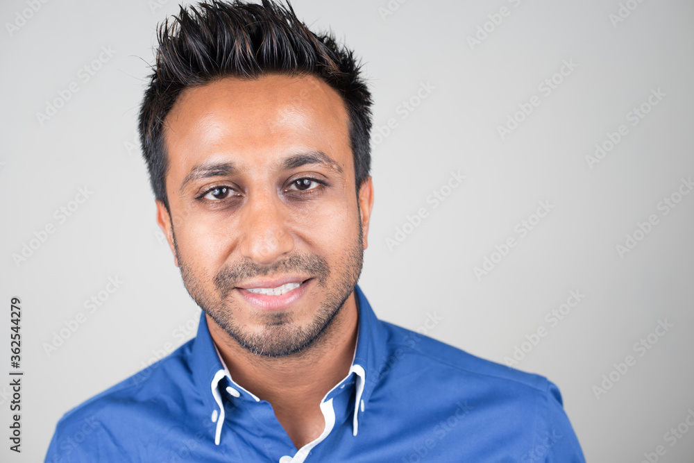Face of happy bearded Indian businessman smiling Face of happy bearded Indian businessman smiling