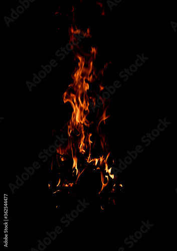 Bright firelight on a black background. Sparks and flames.