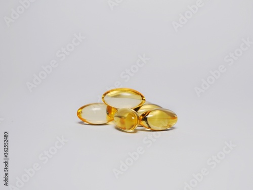 Close up of capsules Omega 3 or fish oil capsules isolated on white background. Healthcare concept