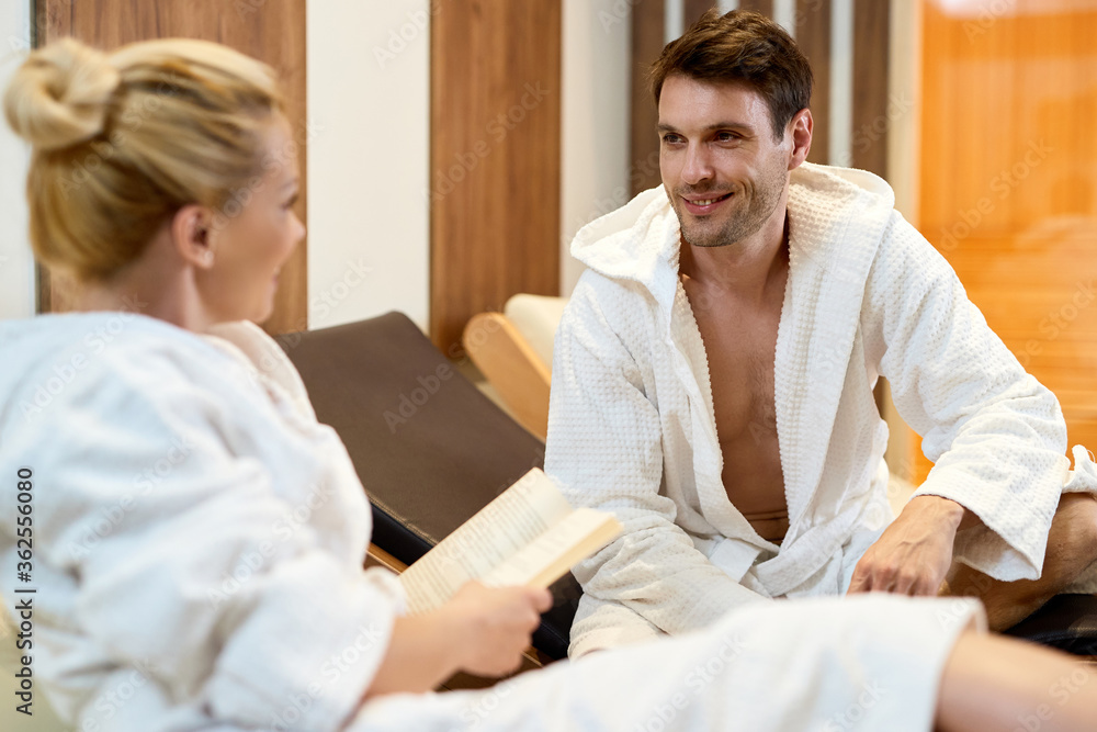 Happy couple talking while spending relaxing day at the spa. Happy couple talking while spending relaxing day at the spa.