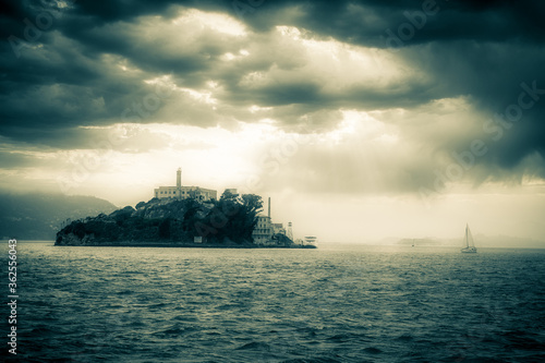 Alacatraz Island Prison in San Francisco Bay on a foggy evening 