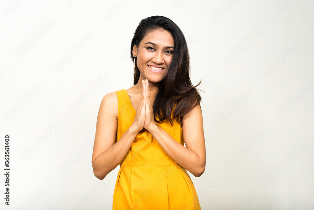 Portrait of happy Asian woman greeting with respect Portrait of happy Asian woman greeting with respect