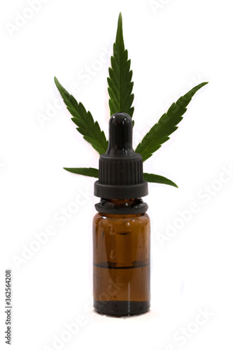 cannabis leaf and oil  hemp  marijuana on a white background in a bottle with a pipette
