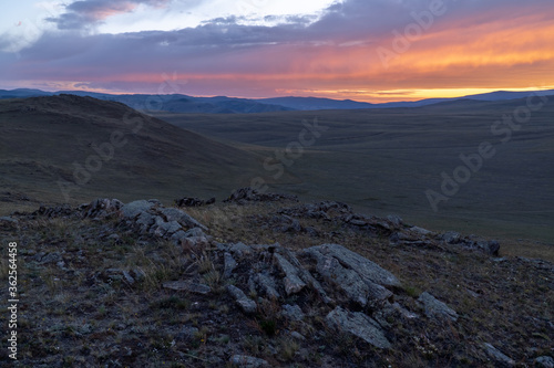Fiery sunset in the rocky Baikal steppe
