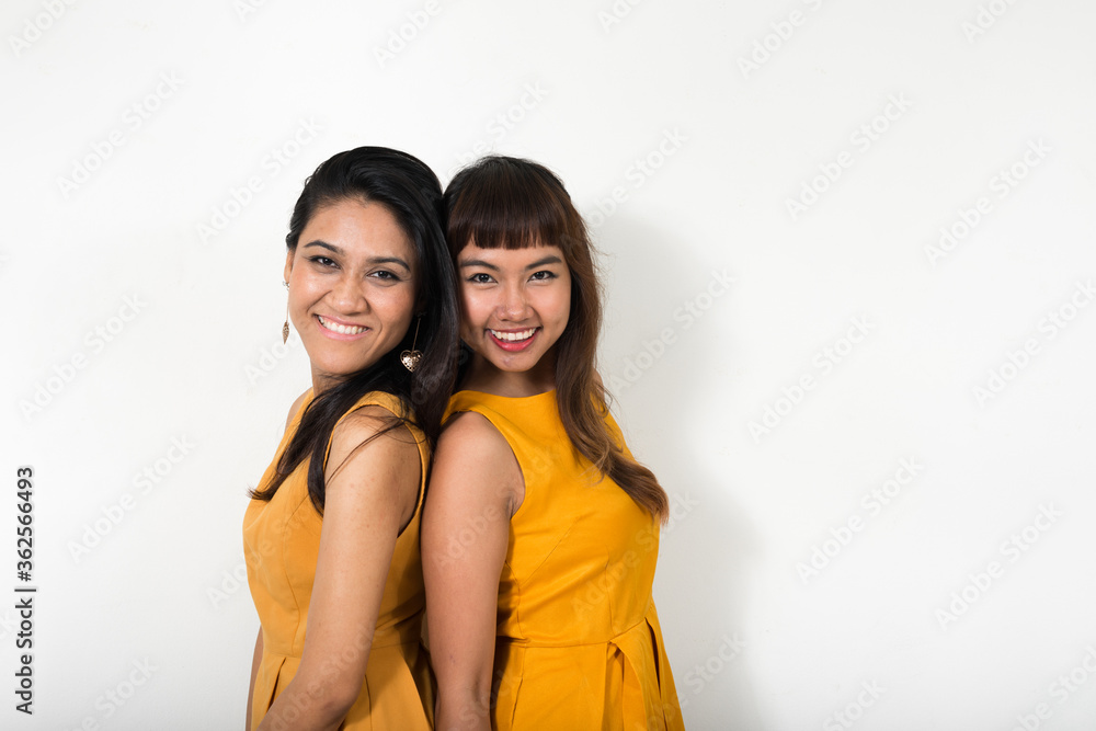 Portrait of two happy young Asian women together Portrait of two happy young Asian women together