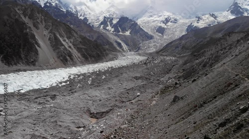 Aerial view of the Nanga Parbat Rakhiot morraine glacier, scattered with rocks and ice, snowy mountaineous landscape, near the Karakorum highway, Gilgit Baltistan region, Pakistan  photo