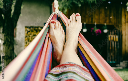 woman feet relaxing in hammock summer zen
