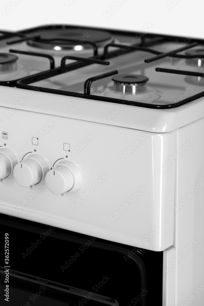 part of a modern gas stove, white part of a modern gas stove, white